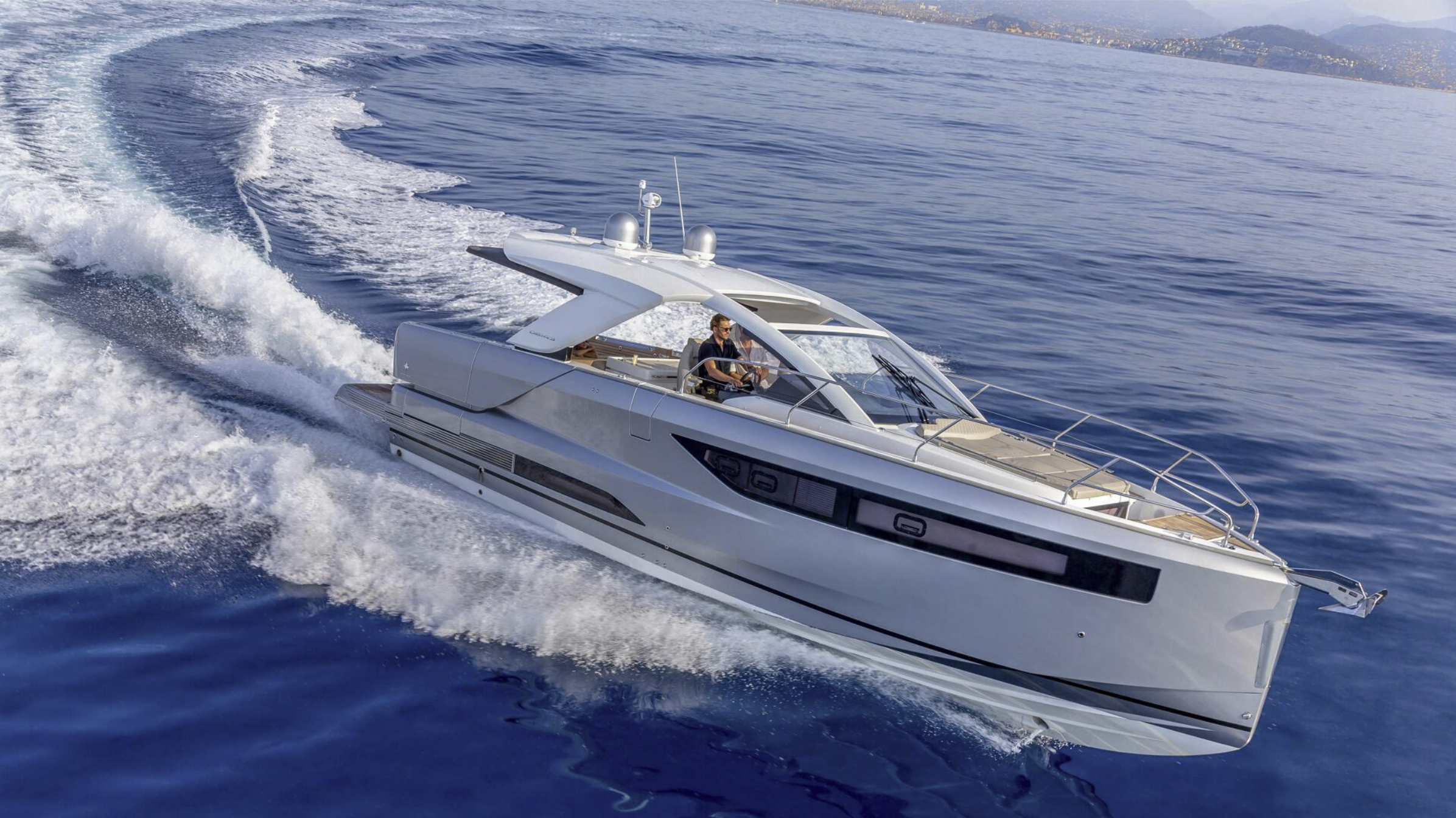 a man driving a boat DB Yacht Jeanneau on the water