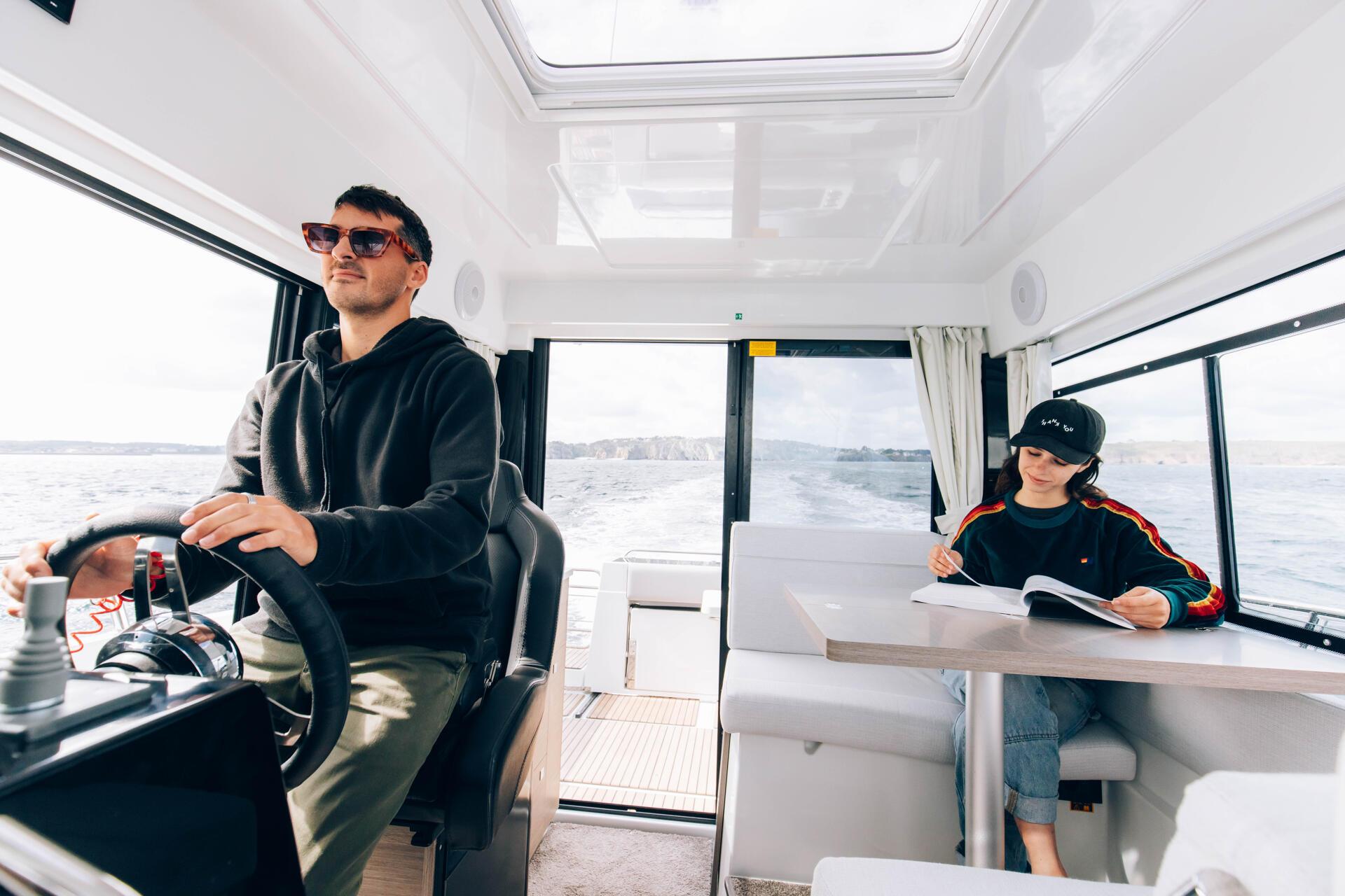 a man and a girl sitting in a boat Merry fisher 895 S2