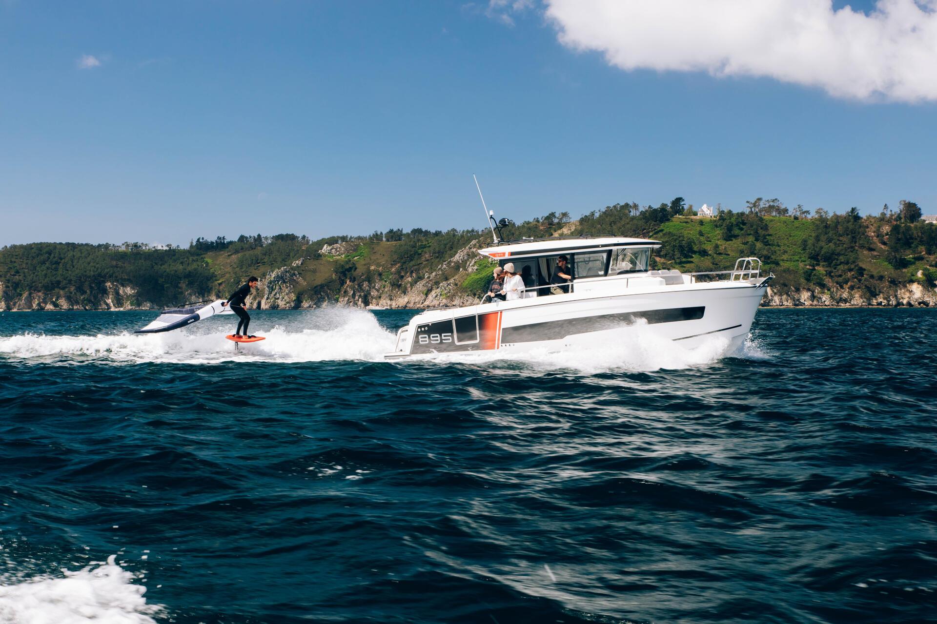 a person on a surfboard riding a boat Merry fisher 895 S2