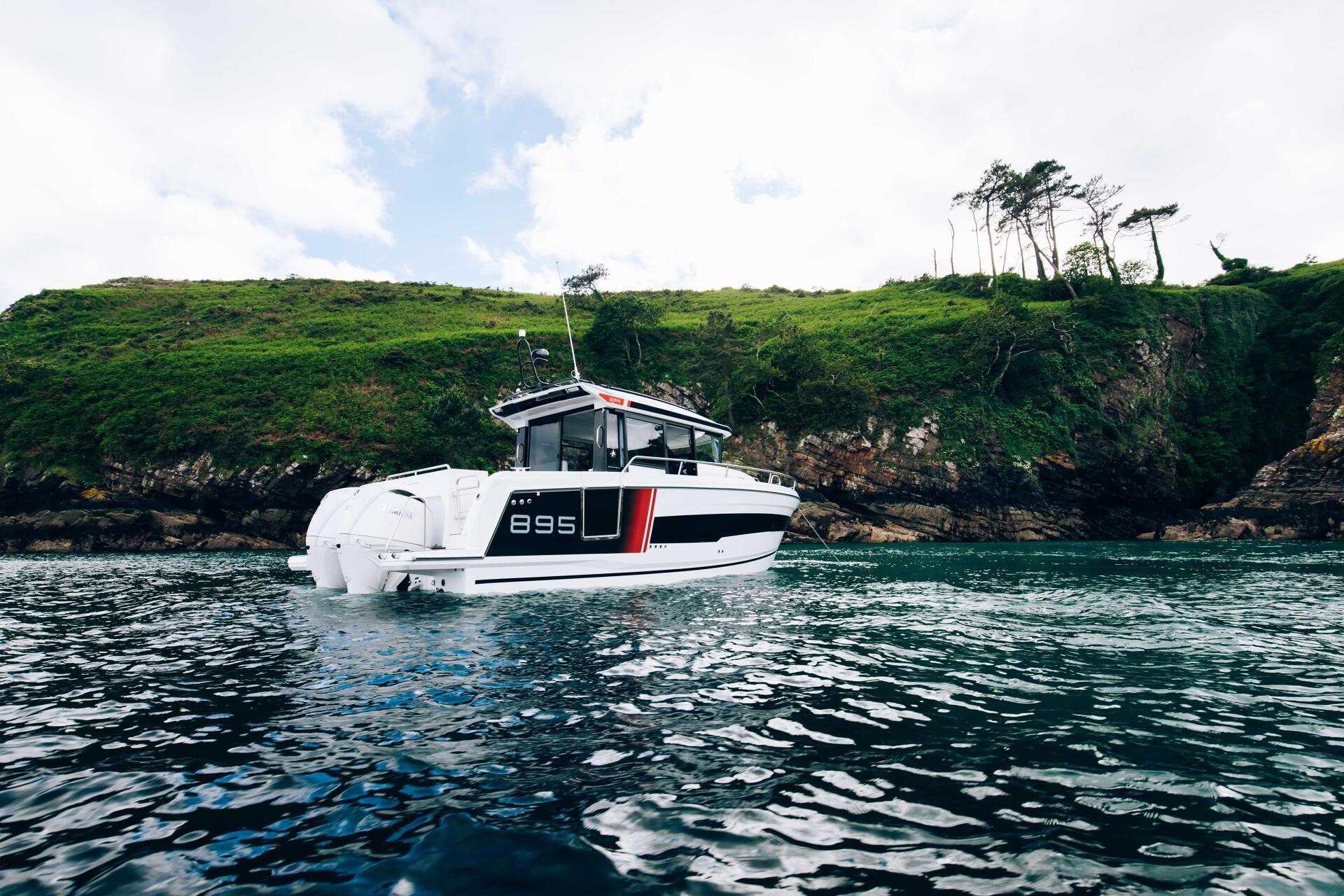 a boat with a boat Merry fisher 895 S2 on the water